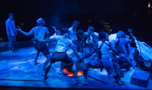 Ralph (Spencer Curnutt, left) watches as Jack (Ty Olwin, center) and his hunters dance around the fire in Steppenwolf for Young Adults’ production of William Golding’s Lord of the Flies adapted by Nigel Williams, directed by Halena Kays.