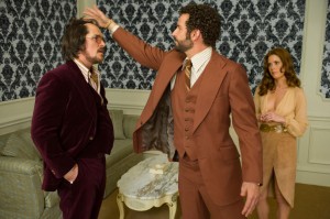 Christian Bale, Bradley Cooper and Amy Adams in Columbia Pictures' AMERICAN HUSTLE