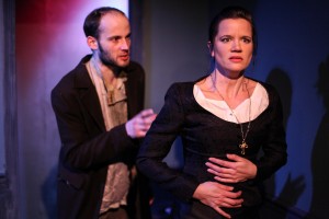 (left to right) Ed Porter and Maureen Yasko in Mary-Arrchie Theatre Co.’s production of CRIME AND PUNISHMENT, based on the novel by Fyodor Dostoyevsky, adapted by Marilyn Campbell and Curt Columbus and directed by Artistic Director Richard Cotovsky. Photo by Emily Schwartz.