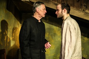 (left to right) Jack McCabe and Ed Porter in Mary-Arrchie Theatre Co.’s production of CRIME AND PUNISHMENT, based on the novel by Fyodor Dostoyevsky, adapted by Marilyn Campbell and Curt Columbus and directed by Artistic Director Richard Cotovsky. Photo by Emily Schwartz.