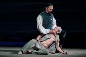 Greer Grimsley as John Claggart (top) with Keith Jameson as the Novice in LA Opera's BILLY BUDD.