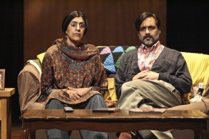 Parents Megha and Archit Gavaskar, played by Rachna Khatau and Anjul Nigam, watching the film MILK in hopes to learn more about their gay son in the comedy A NICE INDIAN BOY  at East West Players.