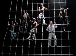 The crew of the HMS Indomitable in LA Opera's BILLY BUDD. Liam Bonner as Billy is at lower right.