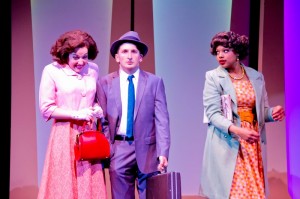 Elizabeth Telford as Rosemary, Tyler Ravelson as J. Pierrepont Finch and Sharriese Hamilton as Smitty in Porchlight Music Theatre’s How to Succeed in Business Without Really Trying.