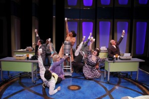 Sharriese Hamilton as Smitty and the cast perform ‘Coffee Break’ in Porchlight Music Theatre’s How to Succeed in Business Without Really Trying.