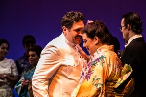 Dylan F. Thomas (Pinkerton, director of production), Marina Harris (Butterfly), and company in Center Stage Opera's MADAMA BUTTERFLY.