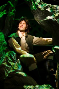 Jack (Tim Homsley) climbs a beanstalk to the Giant’s kingdom in SF Playhouse's INTO THE WOODS.