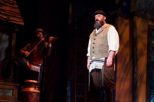 Alex Honzen (Tevye) and Ryan Naimy (Fiddler) in Light Opera Works’ FIDDLER ON THE ROOF.