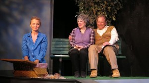 Alexis (Celia Schaefer) imagines picknicking with her parents (Gillien Goll and Bob Ari) in VOICES OF SWORDS.