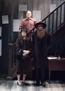 Asher Lev (Alex Weisman, center) doesn't know how his parents (Danica Monroe and Lawrence Grimm) will respond to his paintings in TimeLine Theatre's Chicago premiere of My Name is Asher Lev by Aaron Posner, adapted from the novel by Chaim Potok, directed by Kimberly Senior, presented at Stage 773, 1225 W. Belmont Ave., Chicago, August 22 - October 18, 2014. Photo by Lara Goetsch.