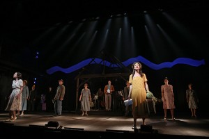 Carmen Cusack (foreground) and cast in The Old Globe's BRIGHT STAR. Photo by Joan Marcus.