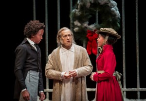 William Burke (Young Scrooge), Larry Yando (Ebenezer Scrooge) and Paige Collins (Fan) in Goodman Theatre's A CHRISTMAS CAROL. Photo by Liz Lauren.