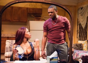 Nina (AnJi White, left) isn't sure she and her boyfriend Damon (Kelvin Roston Jr.) have the same goals in TimeLine Theatre's Chicago premiere of SUNSET BABY by Dominique Morisseau, directed by Ron OJ Parson, presented at 615 W. Wellington Ave., Chicago, January 13 - April 10, 2016. Photo by Lara Goetsch.