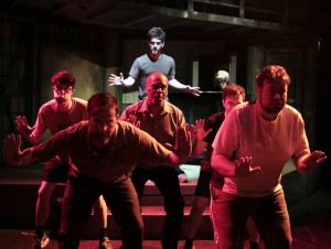 Garrett Lutz (back, center) with (front, left to right) George Toles, Eric Lindahl, Randy Johnson, Greg Foster and Scott Danielson in Kokandy’s Productions’ THE FULL MONTY with music and lyrics by David Yazbek, book by Terrence McNally, directed by John D. Glover, choreography by Danny Spagnuolo and music direction by Kory Danielson. Credit: Joshua Albanese Photography.