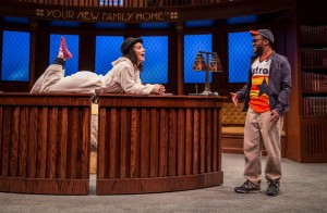 Alejandra Escalante (Rebecca Oaxaca) and Travis Turner (Astros Guy) in The Upstairs Concierge by Kristoffer Diaz, directed by KJ Sanchez at Goodman Theatre.