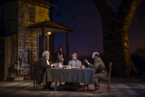 Francis Guinan (Samuel Hamilton), Stephen Park (Lee), and ensemble members Kate Arrington (Cathy Trask) and Tim Hopper (Adam Trask) have dinner together in Steppenwolf Theatre Company’s production of John Steinbeck’s East of Eden, a world premiere adapted by ensemble member Frank Galati and directed by co-founder Terry Kinney.