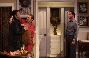 Mike (Joel Reitsma) delivers a record to Mendy (JP Pierson) and Stephen (Joe McCauley) in Eclipse Theatre's THE LISBON TRAVIATA. Photo by Scott Dray.