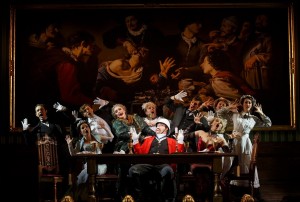The cast with John Rapson as Lord Adalbert D’Ysquith (red) in A GENTLEMAN’S GUIDE TO LOVE AND MURDER National Tour. Photo by Joan Marcus.