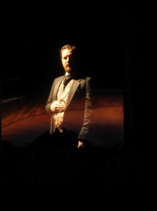 Drew Johnson, vanishing before your eyes in a two-way-mirror stage effect, in City Lit's THE GILDED AGE-A TALE OF TODAY.