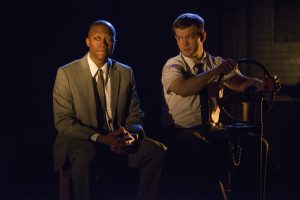 Manny Buckley and Drew Schad in Shattered Globe Theatre’s production of IN THE HEAT OF THE NIGHT, adapted by Matt Pelfrey, based on the novel by John Ball and directed by Louis Contey. Photo by Michael Brosilow.