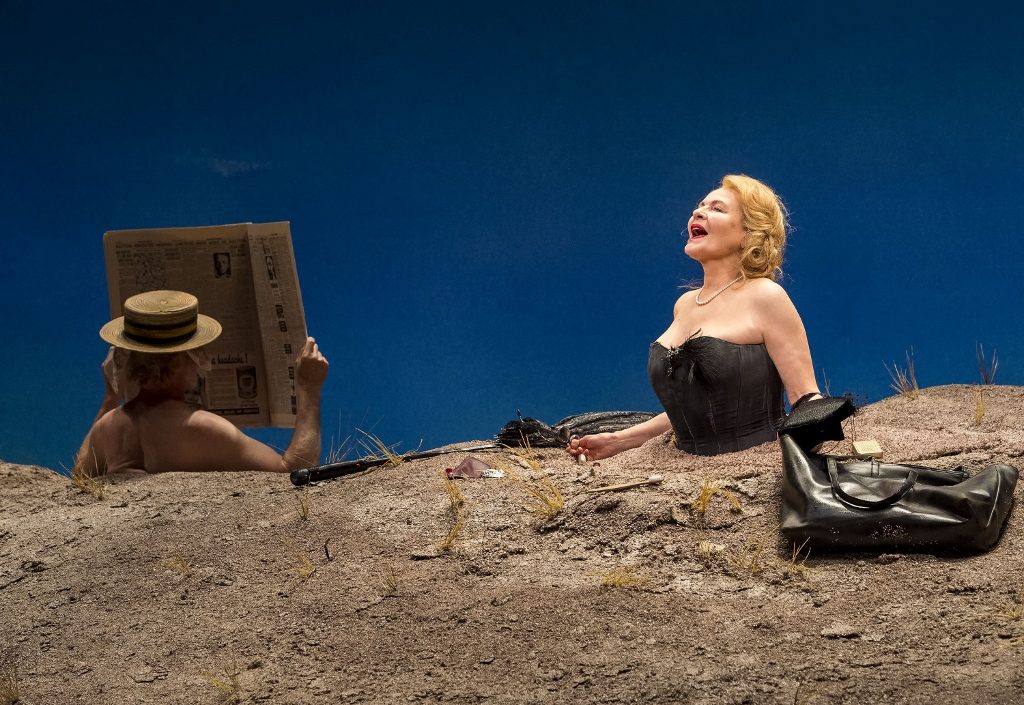 L-R: Michael Rudko (obscured) and Dianne Wiest in the Yale Repertory Theatre production of Samuel Beckett’s “Happy Days” at the Mark Taper Forum. Directed by James Bundy, “Happy Days” will play at the Taper through June 30, 2019.