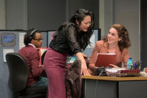 Kendra (Melanie Arii Mah) and Ani (Martha Brigham) sneak a peek at Dean’s manuscript while the intern, Miles (Jared Corbin), watches in Branden Jacobs-Jenkins’s Gloria, performing at A.C.T.’s Strand Theater now through Sunday, April 12, 2020. Photo: Kevin Berne