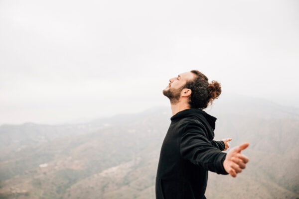 https://www.freepik.com/free-photo/side-view-carefree-man-enjoying-freedom-with-arms-outstretched