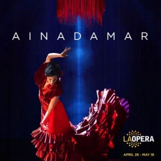 Flamenco dancer in a vibrant red dress under a spotlight with 'AINADAMAR' text.