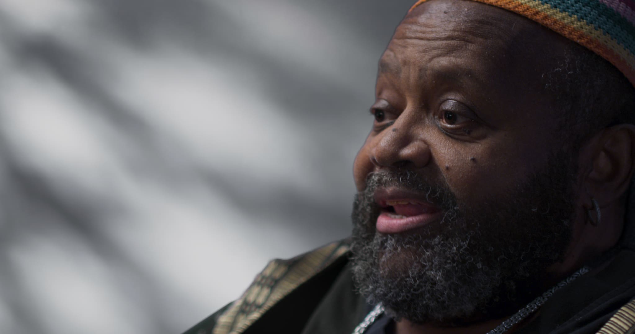 Close-up of a thoughtful man with a beard and mustache.