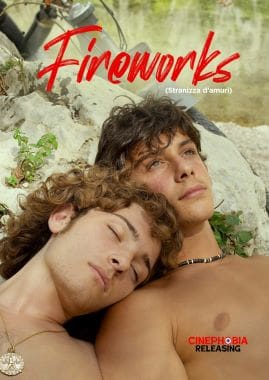 Two young men relaxing outdoors, one resting his head on the other's shoulder.