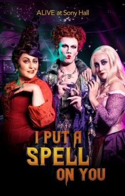 Three people in colorful Halloween costumes posing with the text 'I Put a Spell' below them.