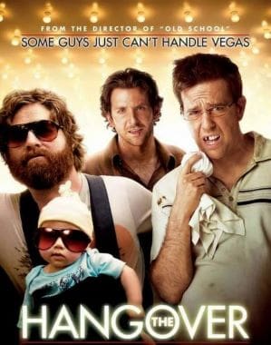 Three men with a baby in a chaotic Vegas scene.
