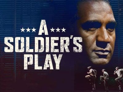 Movie poster for 'A Soldier's Play' featuring a serious man and soldiers.