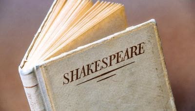 A close-up of an old book titled 'Shakespeare'.