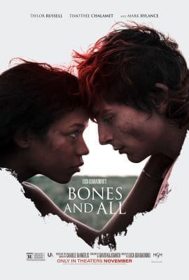 Two people with foreheads touching inside a heart-shaped frame.