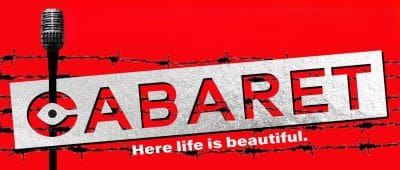 A red sign with the word 'CABARET' and the phrase 'Here life is beautiful.'