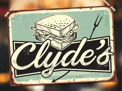 Vintage-style sign for Clyde's sandwich shop with a sandwich illustration.