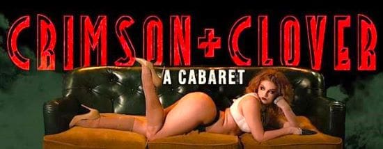 Woman posing on a couch in a cabaret setting.