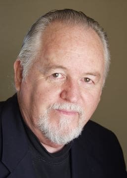 Portrait of an elderly man with white hair and beard.