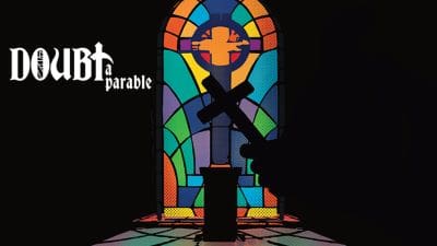 Silhouetted figure stands before a stained glass window with a large cross.