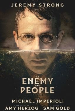 Close-up of a man's face with glasses, split by a horizontal line, titled 'Enemy People'.