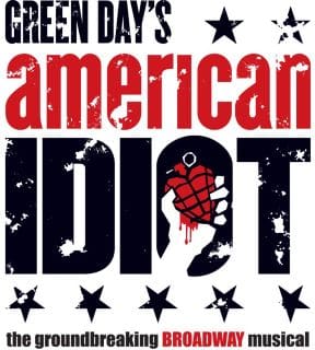 Album cover for Green Day's American Idiot with bold text and a hand holding a grenade heart.