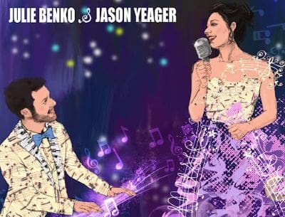 A man and woman sing on stage with vibrant purple and blue lights.