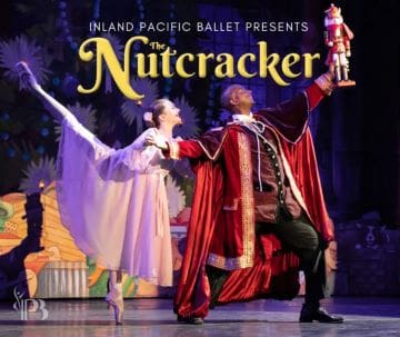 Ballet dancers perform a scene from The Nutcracker on stage.