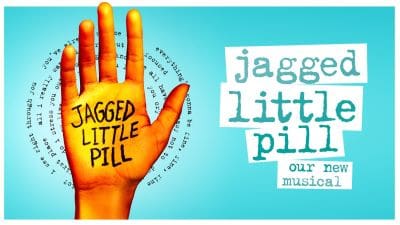 An orange hand with 'Jagged Little Pill' written on it, promoting a musical.
