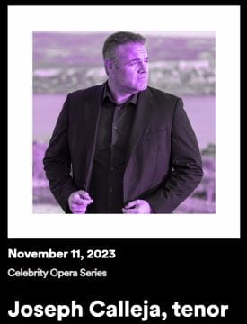A man in a black suit stands against a blurred city backdrop on November 11, 2023.
