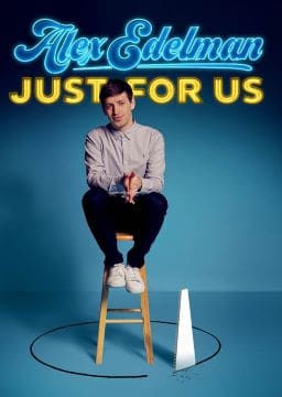Man sitting on a stool with a blue background and yellow text.