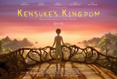 A boy stands on a bridge overlooking a sunset in Kensuke's Kingdom.