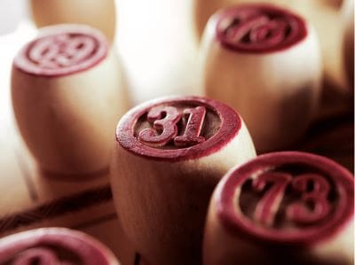 Close-up of bingo number stamps with red inked ends.