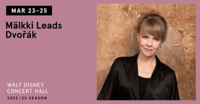 Portrait of a woman in black against a textured brown background.